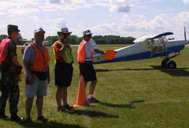 Flight Line flagman, Civil Air Patrol and volunteers maning the flight line at Airventure.